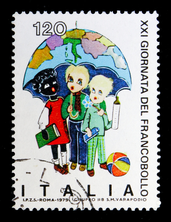 MOSCOW, RUSSIA - MAY 10, 2018: A stamp printed in Italy shows Children under the umbrella, devoted to Stamp Day, serie, circa 1979のeditorial素材