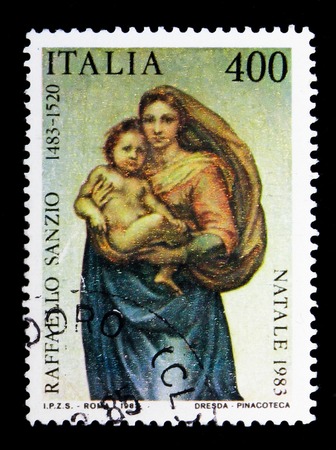 MOSCOW, RUSSIA - MAY 10, 2018: A stamp printed in Italy shows Painting by Raffaelo Sanzio, Christmas, serie, circa 1983のeditorial素材