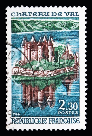 MOSCOW, RUSSIA - MAY 10, 2018: A stamp printed in France shows Castle Val, Lake of Bort-les-Orgues, Tourism serie, circa 1966のeditorial素材