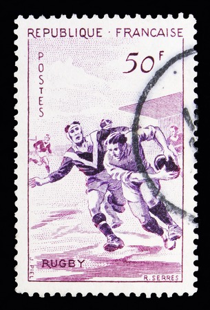 MOSCOW, RUSSIA - MAY 10, 2018: A stamp printed in France shows Rugby, Sports serie, circa 1956のeditorial素材