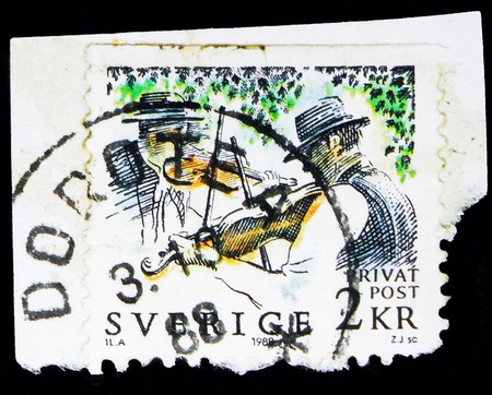 MOSCOW, RUSSIA - MAY 10, 2018: A stamp printed in Sweden shows Fiddlers, Rebate stamps - Midsummer Festival serie, circa 1988のeditorial素材