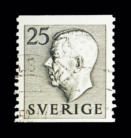 MOSCOW, RUSSIA - MAY 10, 2018: A stamp printed in Sweden shows King Gustaf VI Adolf, serie, circa 1951のeditorial素材