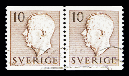 MOSCOW, RUSSIA - MAY 10, 2018: Two postage stamps printed in Sweden shows King Gustaf VI Adolf, serie, circa 1954のeditorial素材