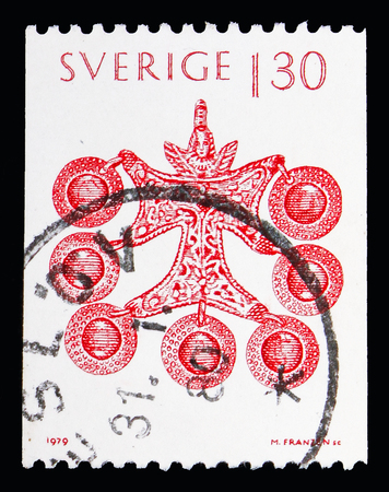 MOSCOW, RUSSIA - MAY 10, 2018: A stamp printed in Sweden shows Brooch from Smaland, Christmas serie, circa 1979のeditorial素材