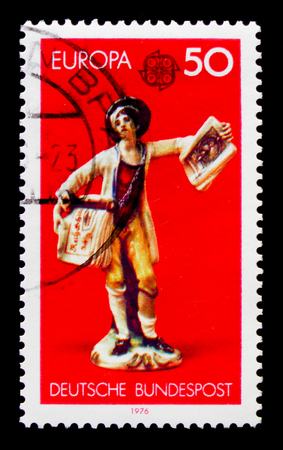 MOSCOW, RUSSIA - OCTOBER 21, 2017: A stamp printed in Germany Federal Republic shows Figurine, Europa (C.E.P.T.) 1976 - Handicrafts serie, circa 1976のeditorial素材