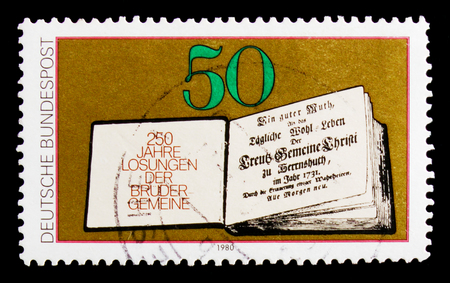MOSCOW, RUSSIA - OCTOBER 21, 2017: A stamp printed in Germany Federal Republic shows 250st edition Losungsbuches, 250th Edition of Moravian Brethren's Book of Bible Readings serie, circa 1980のeditorial素材