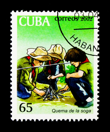MOSCOW, RUSSIA - NOVEMBER 25, 2017: A stamp printed in Cuba shows tarting fire, Explorers serie, circa 2002のeditorial素材