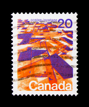 MOSCOW, RUSSIA - NOVEMBER 24, 2017: A stamp printed in Canada shows Prairie landscape from the air, Definitives 1972-77 serie, circa 1972のeditorial素材