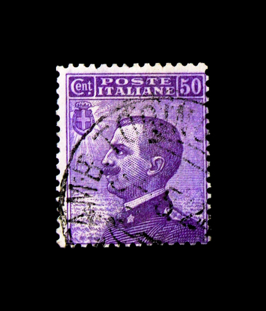 MOSCOW, RUSSIA - NOVEMBER 24, 2017: A stamp printed in Italy shows Effigy of Vittorio Emanuele III to the left , Michetti serie, circa 1908のeditorial素材