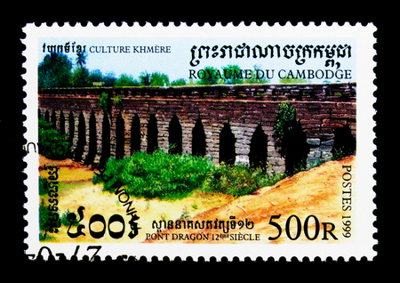 MOSCOW, RUSSIA - NOVEMBER 24, 2017: A stamp printed in Cambodia shows Dragon Bridge, 12th Century, 
Khmer Culture serie, circa 1999のeditorial素材