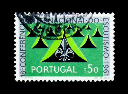 MOSCOW, RUSSIA - NOVEMBER 24, 2017: A stamp printed in Portugal shows Tents and Scout emblems, Scouting serie, circa 1962のeditorial素材