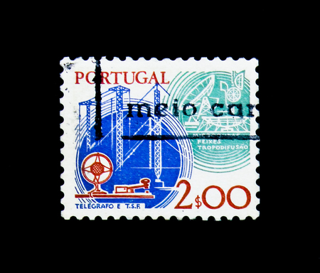 MOSCOW, RUSSIA - NOVEMBER 24, 2017: A stamp printed in Portugal shows Telegraph key and masts, microwaves and dish aerial, serie, circa 1980のeditorial素材