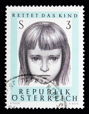 MOSCOW, RUSSIA - MAY 13, 2018: A stamp printed in Austria shows Portrait of a girl, Austrian Organisation "Save the child" serie, circa 1966のeditorial素材