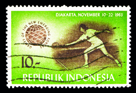 MOSCOW, RUSSIA - MAY 13, 2018: A stamp printed in Indonesia shows Tennis, Games of the New Emerging Forces serie, circa 1963のeditorial素材