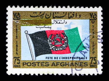 MOSCOW, RUSSIA - MAY 13, 2018: A stamp printed in Afghanistan shows Afghan Flag, 46th Independence Day serie, circa 1964のeditorial素材