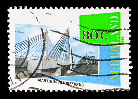 MOSCOW, RUSSIA - MAY 13, 2018: A stamp printed in Netherlands shows Martinus Nijhoff Bridge across the Waal river, Netherlands, country of water serie, circa 1996のeditorial素材