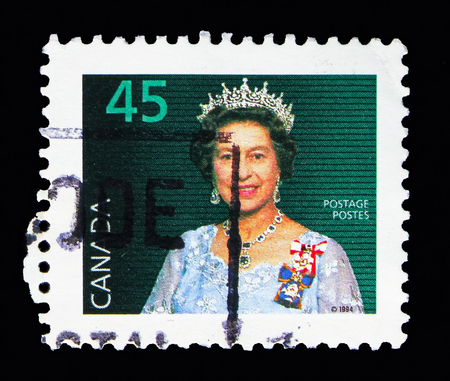 MOSCOW, RUSSIA - MAY 13, 2018: A stamp printed in Canada shows Queen Elizabeth II, Definitives 1985-2000 serie, circa 1995のeditorial素材