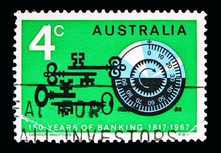 MOSCOW, RUSSIA - MAY 16, 2018: A stamp printed in Australia shows Old keys, combination lock, 150 years bank of Australia serie, circa 1967のeditorial素材