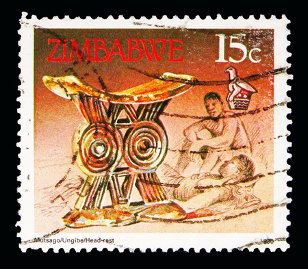 MOSCOW, RUSSIA - MAY 16, 2018: A stamp printed in Zimbabwe shows Head-rest, Animals, Hand Crafts and Transportation serie, circa 1990のeditorial素材