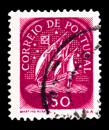 MOSCOW, RUSSIA - MAY 16, 2018: A stamp printed in Portugal shows Caravel (15th Century), serie, circa 1943のeditorial素材
