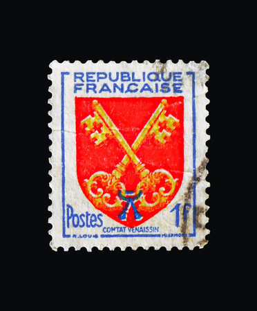 MOSCOW, RUSSIA - AUGUST 18, 2018: A stamp printed in France shows Comtat Venaissin, Coat of Arms serie, circa 1955のeditorial素材