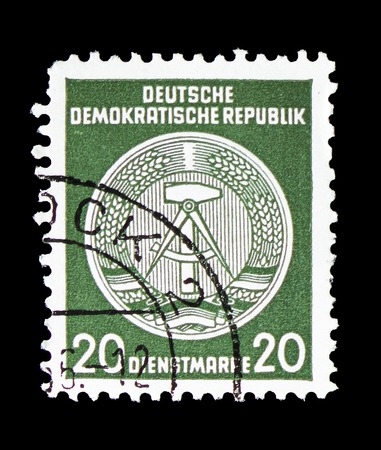 MOSCOW, RUSSIA - SEPTEMBER 15, 2018: A stamp printed in German Federal Republic (Germany) shows Official Stamps for Administration Post B (I) Reprint, Hammer and Compass (Offset) serie, circa 1957のeditorial素材