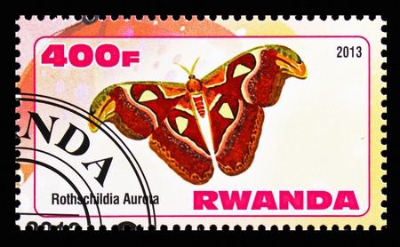 MOSCOW, RUSSIA - OCTOBER 21, 2018: A stamp printed in Rwanda shows Rothschildia Aurota, Butterflies serie, circa 2013のeditorial素材