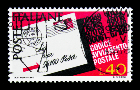 MOSCOW, RUSSIA - APRIL 15, 2018: A stamp printed in Italy shows Postcard highlighted the postcode, Introduction of Postal Code serie, circa 1968のeditorial素材