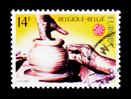 MOSCOW, RUSSIA - APRIL 15, 2018: A stamp printed in Belgium shows C.E.P.T. Handicraft - Potter's hands, serie, circa 1976のeditorial素材
