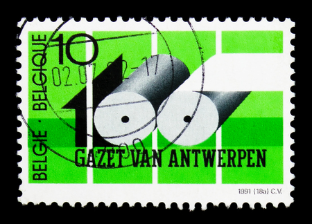 MOSCOW, RUSSIA - APRIL 15, 2018: A stamp printed in Belgium shows Newspapers of Antwerpen, circa 1991のeditorial素材