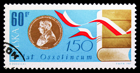 MOSCOW, RUSSIA - SEPTEMBER 15, 2018: A stamp printed in Poland shows Ossolinski Medal, book and ribbons, circa 1967のeditorial素材
