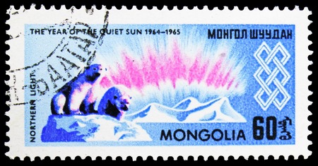 MOSCOW, RUSSIA - NOVEMBER 26, 2018: A stamp printed in Mongolia shows Northern light, International Year of the Sun serie, circa 1965のeditorial素材