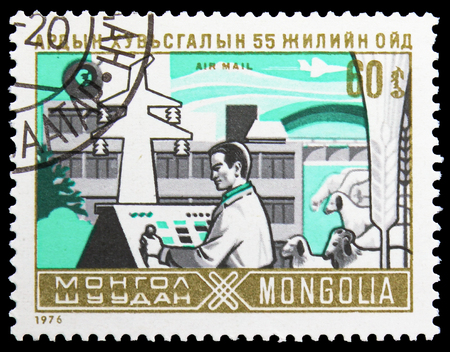 MOSCOW, RUSSIA - NOVEMBER 26, 2018: A stamp printed in Mongolia shows Worker, symbol of the agriculture, 55th anniversary of Mongoliaâs independence serie, circa 1976のeditorial素材