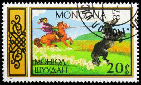 MOSCOW, RUSSIA - NOVEMBER 26, 2018: A stamp printed in Mongolia shows Lassoer, Equestrian Sports serie, circa 1987のeditorial素材