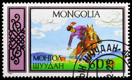 MOSCOW, RUSSIA - NOVEMBER 26, 2018: A stamp printed in Mongolia shows Retrieving flags, Equestrian Sports serie, circa 1987のeditorial素材
