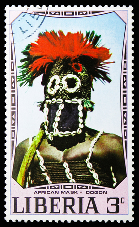 MOSCOW, RUSSIA - NOVEMBER 10, 2018: A stamp printed in Liberia shows Dogon mask, African Masks serie, circa 1971のeditorial素材