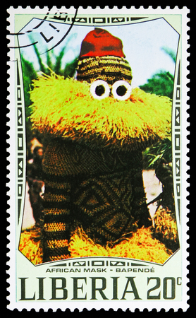 MOSCOW, RUSSIA - NOVEMBER 10, 2018: A stamp printed in Liberia shows Bapende mask and costume, African Masks serie, circa 1971のeditorial素材