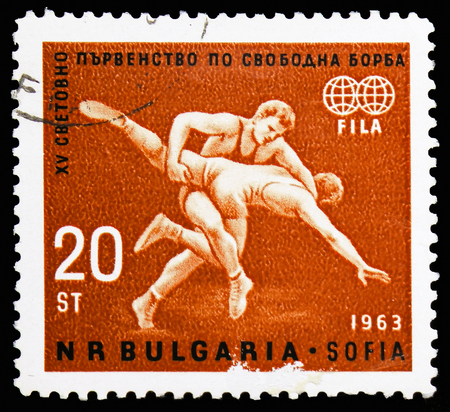 MOSCOW, RUSSIA - NOVEMBER 10, 2018: A stamp printed in Bulgaria shows Wrestling Scene, World Championships in Freestyle Wrestling serie, circa 1963のeditorial素材
