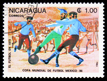 MOSCOW, RUSSIA - FEBRUARY 9, 2019: A stamp printed in Nicaragua shows Evolution of Football, year 1872, FIFA World Cup 1986 - Mexico serie, circa 1985のeditorial素材