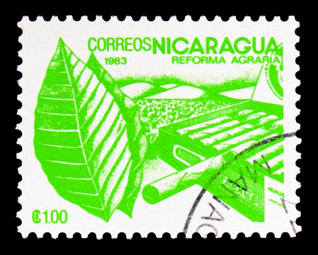 MOSCOW, RUSSIA - FEBRUARY 9, 2019: A stamp printed in Nicaragua shows Tobacco, Agrarian Reform serie, circa 1983のeditorial素材