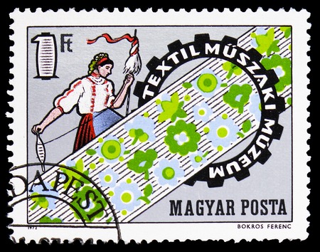 MOSCOW, RUSSIA - FEBRUARY 9, 2019: A stamp printed in Hungary shows Opening of Museum of Textile Techniques, Events serie, circa 1972のeditorial素材