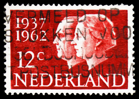 MOSCOW, RUSSIA - FEBRUARY 10, 2019: A stamp printed in Netherlands shows Queen Juliana and Prince Bernhard, 25 years Wedding Anniversary Stamps serie, circa 1962のeditorial素材