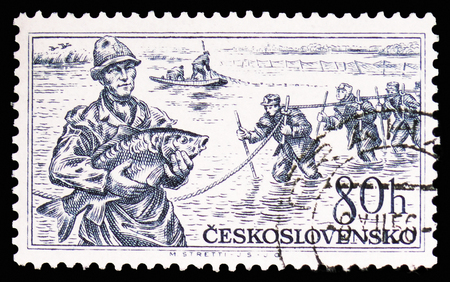 MOSCOW, RUSSIA - FEBRUARY 10, 2019: A stamp printed in Czechoslovakia shows Fishermen, Czechoslovak Richness serie, circa 1956のeditorial素材