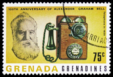 MOSCOW, RUSSIA - FEBRUARY 10, 2019: A stamp printed in Grenada Grenadines shows Telephone 1920, Centenary of first telephone conversation March 10, 1876 serie, circa 1977のeditorial素材