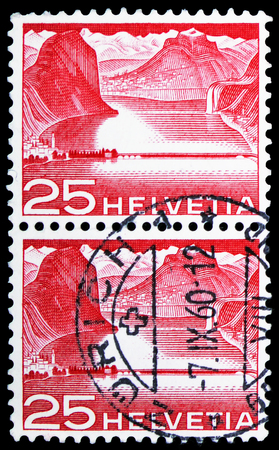 MOSCOW, RUSSIA - FEBRUARY 10, 2019: A stamp printed in Switzerland shows Dam near Melide (Lake Lugano), Landscapes and technics serie, circa 1949のeditorial素材