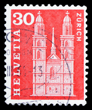 MOSCOW, RUSSIA - FEBRUARY 10, 2019: A stamp printed in Switzerland shows Grossmunster in Zurich, Postal history motives and monuments serie, circa 1963のeditorial素材