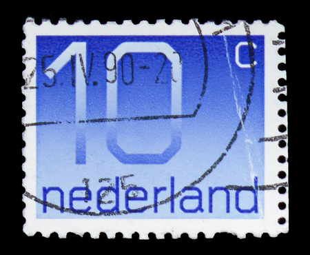 MOSCOW, RUSSIA - FEBRUARY 10, 2019: A stamp printed in Netherlands shows Numeral, 10 Dutch cents, Figure type "Crouwel" serie, circa 1976のeditorial素材