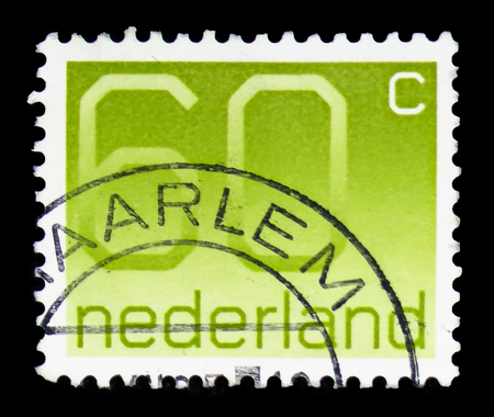 MOSCOW, RUSSIA - FEBRUARY 10, 2019: A stamp printed in Netherlands shows Numeral, 60 Dutch cents, Figure type "Crouwel" serie, circa 1981のeditorial素材