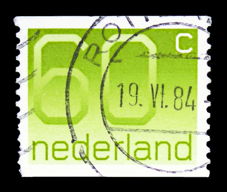MOSCOW, RUSSIA - FEBRUARY 10, 2019: A stamp printed in Netherlands shows Numeral, 60 Dutch cents, Figure type "Crouwel" serie, circa 1981のeditorial素材