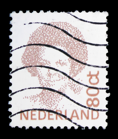 MOSCOW, RUSSIA - FEBRUARY 10, 2019: A stamp printed in Netherlands shows Queen Beatrix, Type "Inversion" serie, circa 1996のeditorial素材